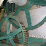 Late nineteenth century hydro powered gearing that drives the processing equipment in the mill at Doka. Photo by Barth Anderson.