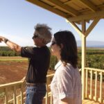 Christina and MauiGrown farm owner Kimo Falconer overlooking the orchard. Photo courtesy of Zachary Ethier.